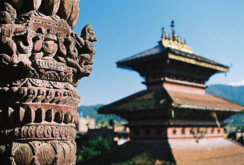 
Carved wood on Nyatapola Temple. In the back Bhairab Temple. Bhaktapur.
